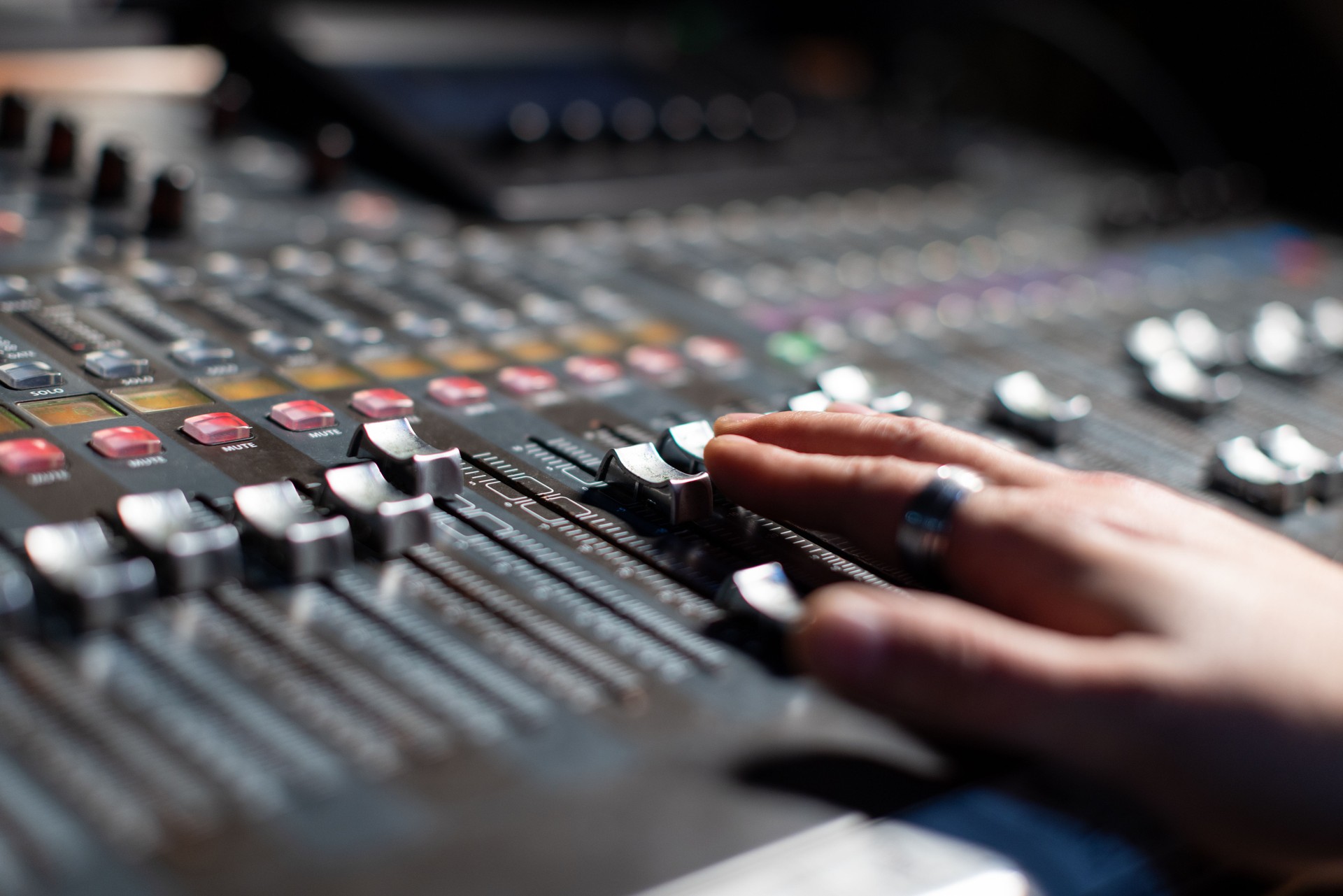 Close up photo of audio mixing console